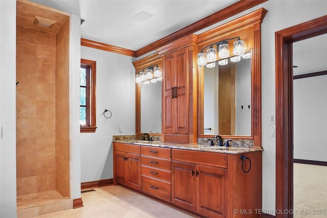 bathroom with crown molding, a shower, and vanity