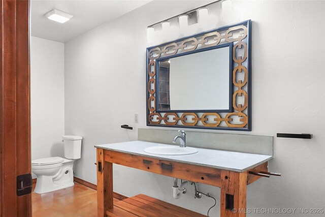 bathroom with sink and toilet