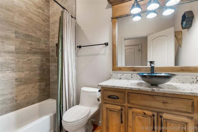 full bathroom featuring toilet, vanity, and shower / bath combination with curtain