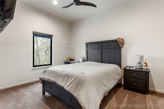 carpeted bedroom with ceiling fan and lofted ceiling