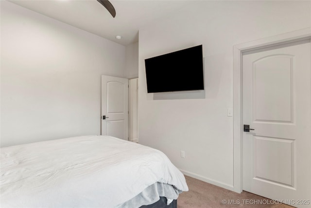 bedroom featuring ceiling fan and light carpet