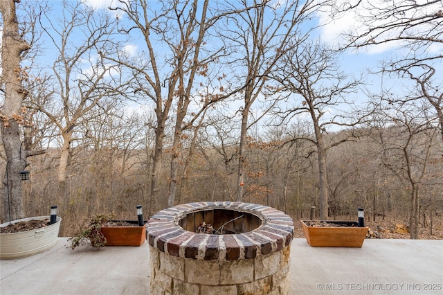 view of patio featuring an outdoor fire pit