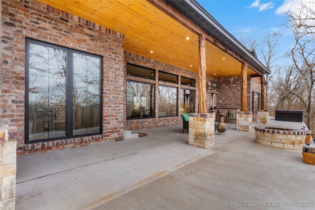 view of patio / terrace featuring an outdoor fire pit