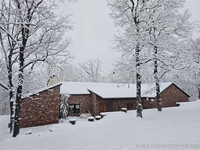 view of snow covered property