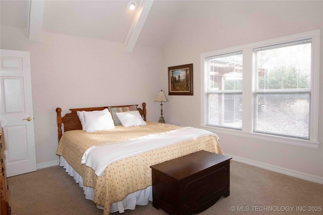 carpeted bedroom featuring multiple windows and lofted ceiling with beams