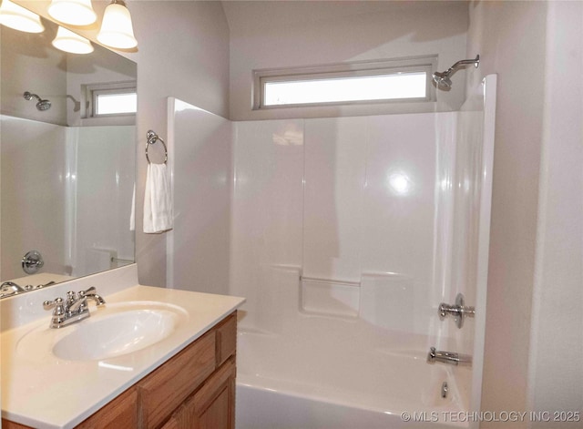 bathroom with vanity and shower / bath combination