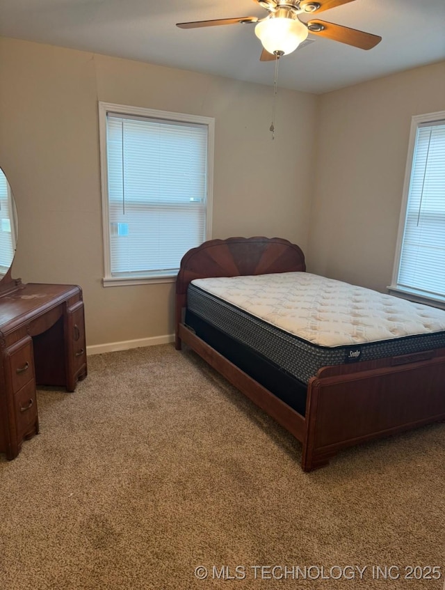 bedroom featuring ceiling fan and light carpet