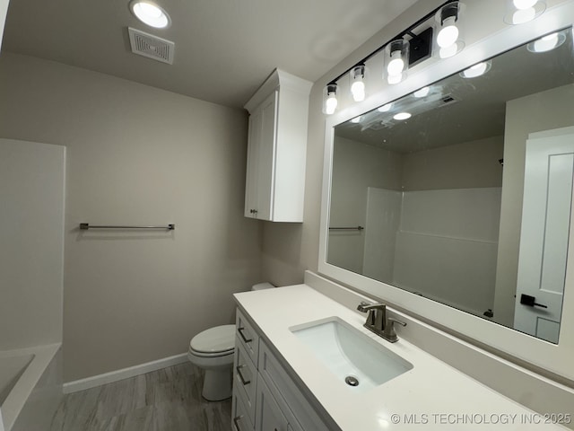 full bathroom with a shower, visible vents, toilet, vanity, and baseboards