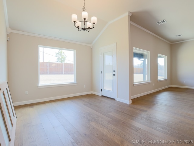 entryway featuring visible vents, light wood-style flooring, a healthy amount of sunlight, and an inviting chandelier