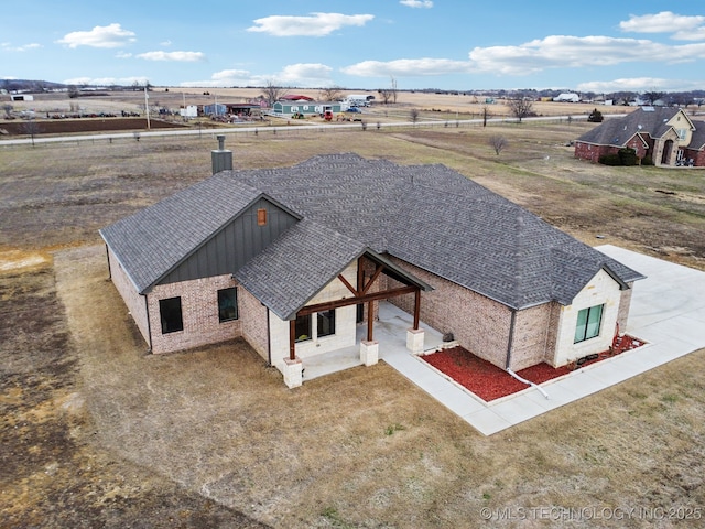 birds eye view of property featuring a rural view