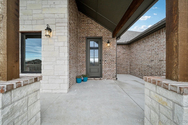 entrance to property with a patio area