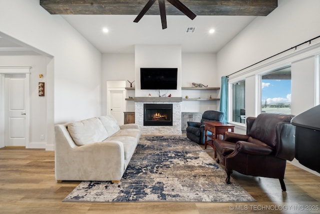 living room featuring light wood-type flooring and ceiling fan