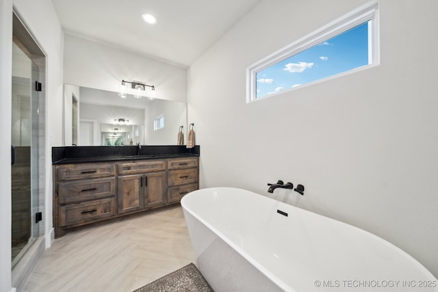 bathroom with plus walk in shower and vanity