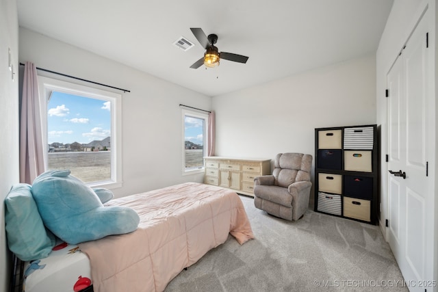 carpeted bedroom featuring ceiling fan