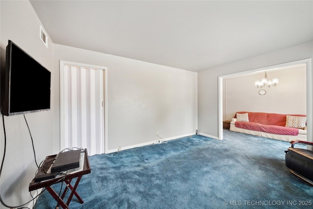 living room featuring carpet floors and a notable chandelier