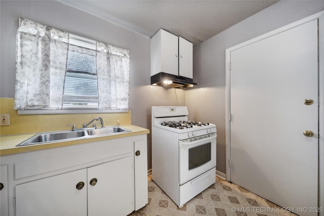 kitchen featuring sink, a textured ceiling, white cabinets, and white gas range oven