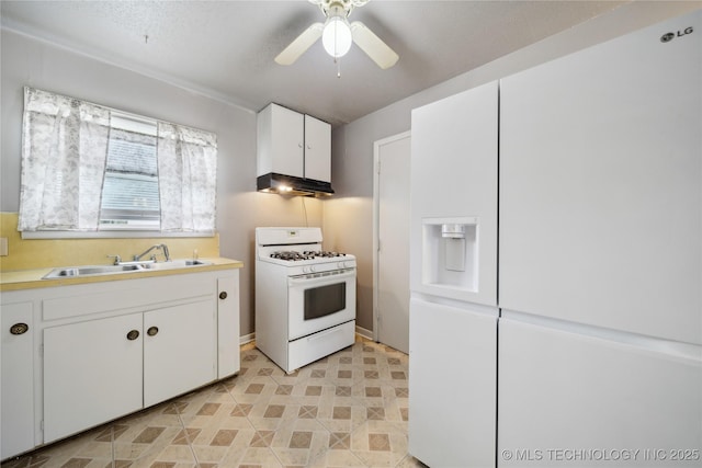 kitchen with ceiling fan, sink, white cabinets, and white appliances