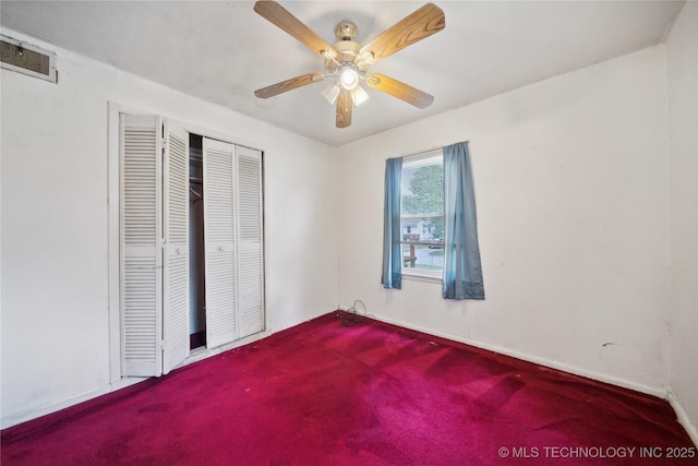 unfurnished bedroom featuring ceiling fan and a closet