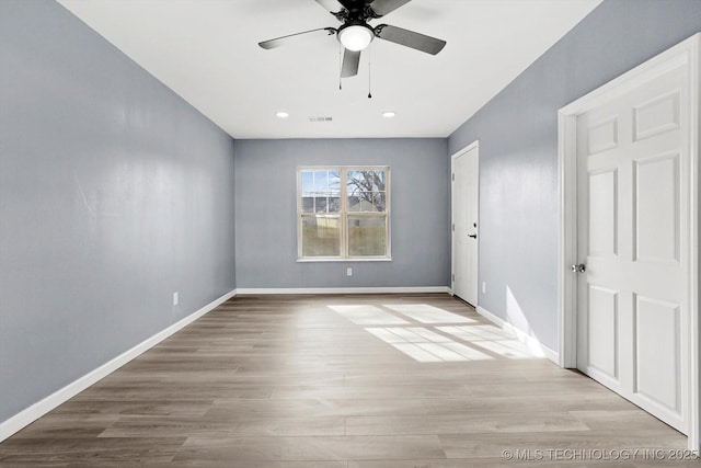 unfurnished room featuring ceiling fan and light hardwood / wood-style flooring