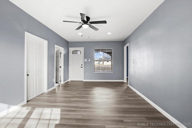 foyer with ceiling fan and hardwood / wood-style floors