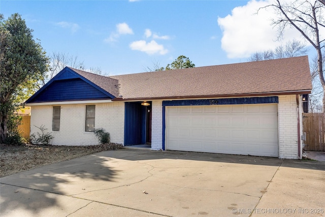 ranch-style home featuring a garage