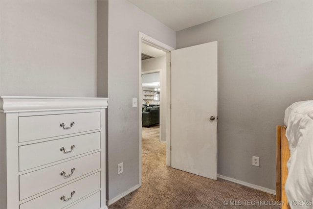 bedroom with light colored carpet