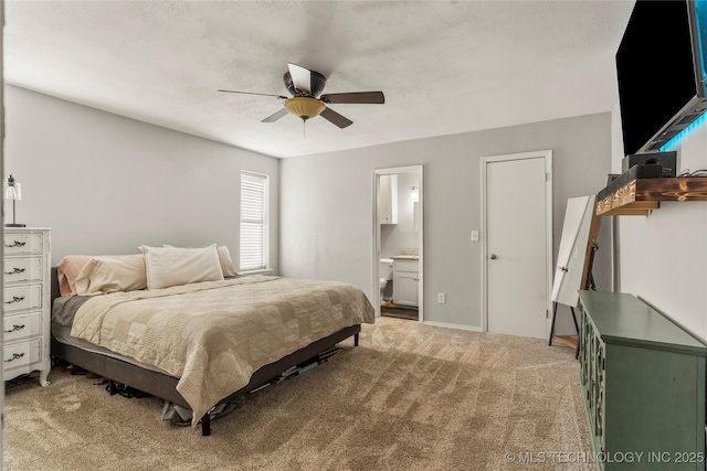 bedroom featuring light carpet, connected bathroom, and ceiling fan