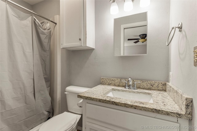 bathroom featuring vanity, ceiling fan, toilet, and a shower with shower curtain