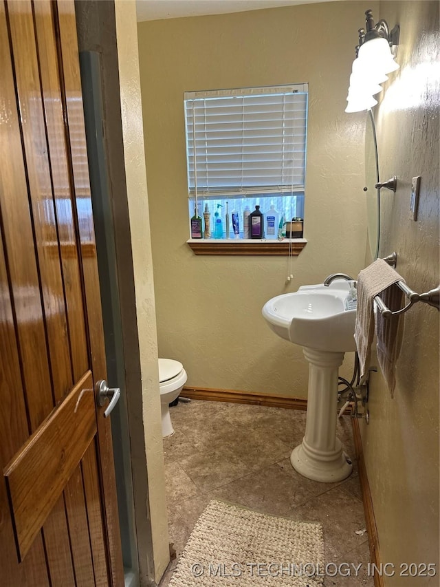 bathroom featuring toilet