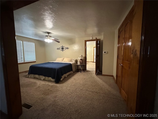 bedroom with ceiling fan and light colored carpet