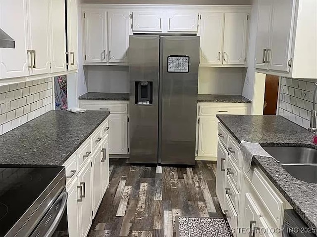 kitchen with white cabinetry, stainless steel fridge, black dishwasher, dark hardwood / wood-style floors, and tasteful backsplash