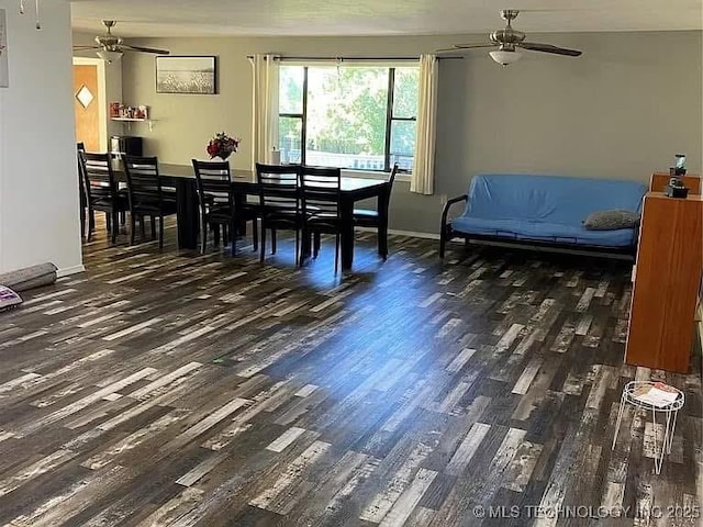 dining space with ceiling fan and dark hardwood / wood-style floors