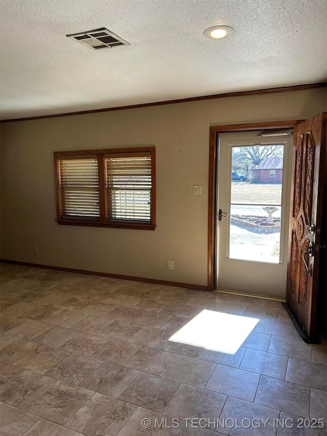 interior space featuring a textured ceiling