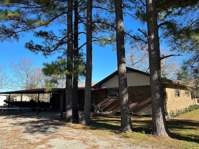 view of side of property with a carport