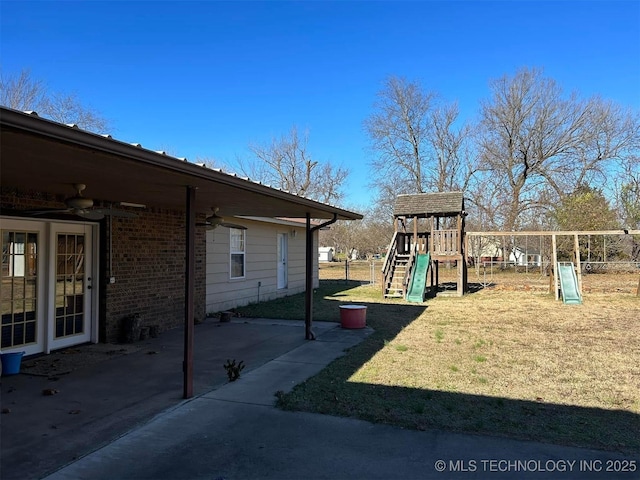 view of play area with a patio area and a yard