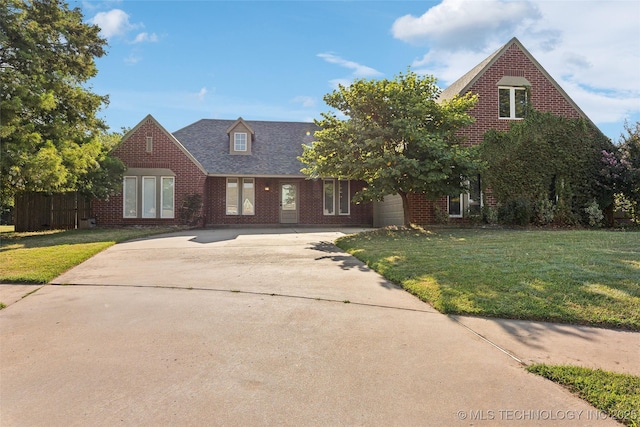 view of front facade with a garage and a front yard