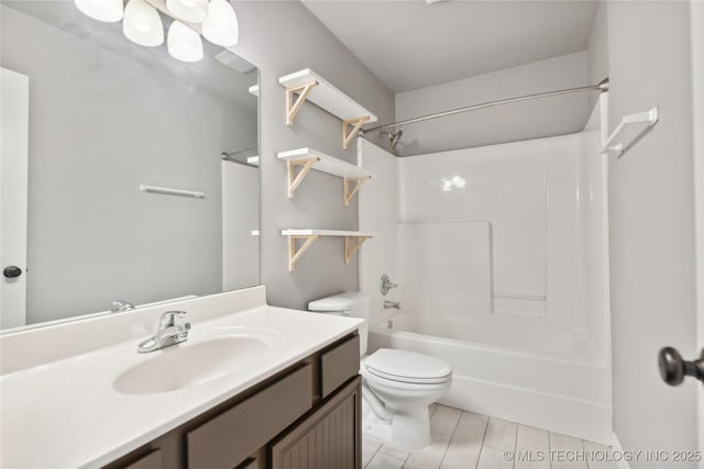 full bathroom featuring toilet, vanity, shower / bathtub combination, and wood-type flooring