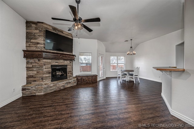 unfurnished living room featuring ceiling fan, dark hardwood / wood-style floors, a fireplace, and lofted ceiling