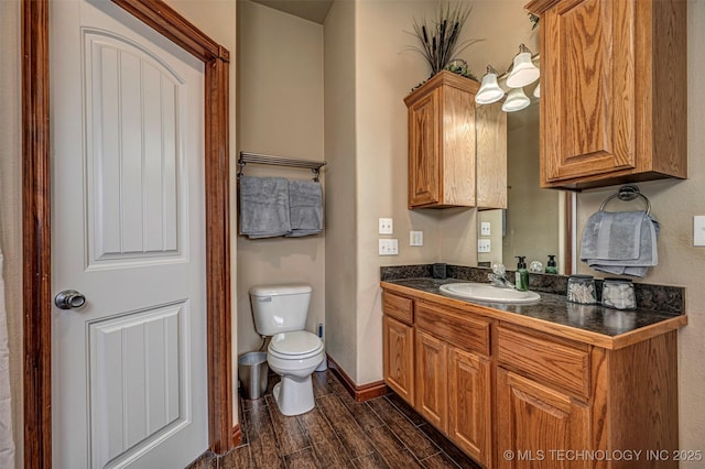 bathroom with toilet and vanity