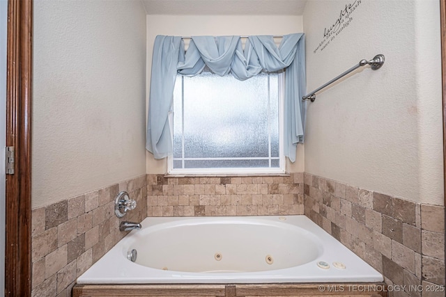 bathroom featuring tiled bath