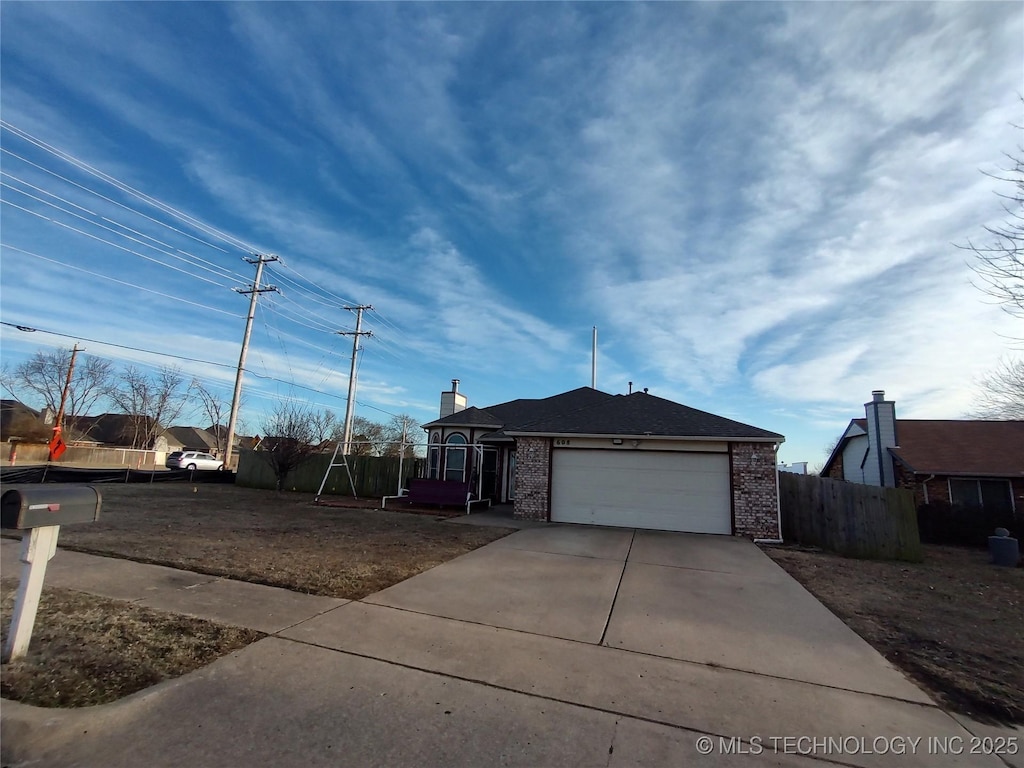 single story home featuring a garage