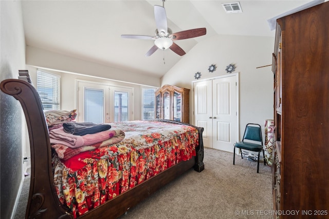 bedroom featuring light carpet, visible vents, lofted ceiling, ceiling fan, and french doors