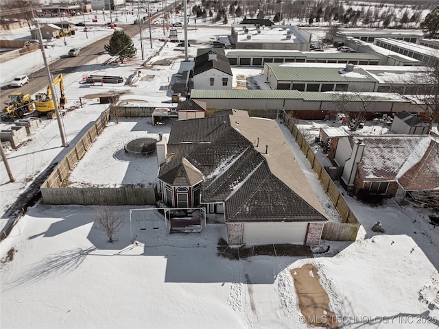 snowy aerial view featuring a residential view