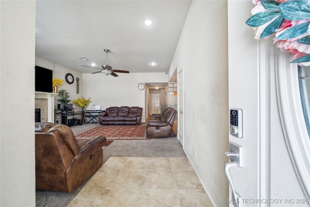 living room featuring light tile patterned floors, recessed lighting, visible vents, a ceiling fan, and a tiled fireplace