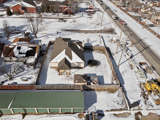 snowy aerial view featuring a residential view