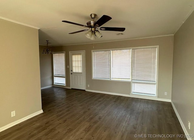 spare room with ceiling fan, dark wood-type flooring, and ornamental molding