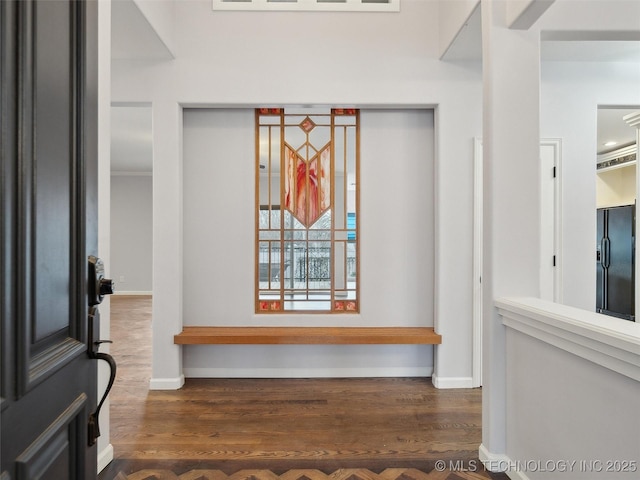 room details featuring black fridge and hardwood / wood-style floors