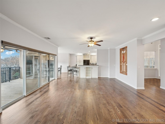 unfurnished living room with ceiling fan, wood-type flooring, and crown molding