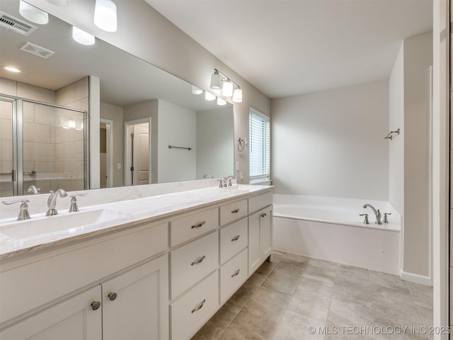 bathroom with separate shower and tub and vanity