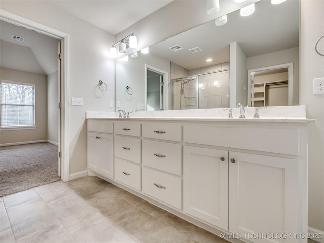 bathroom with an enclosed shower and vanity